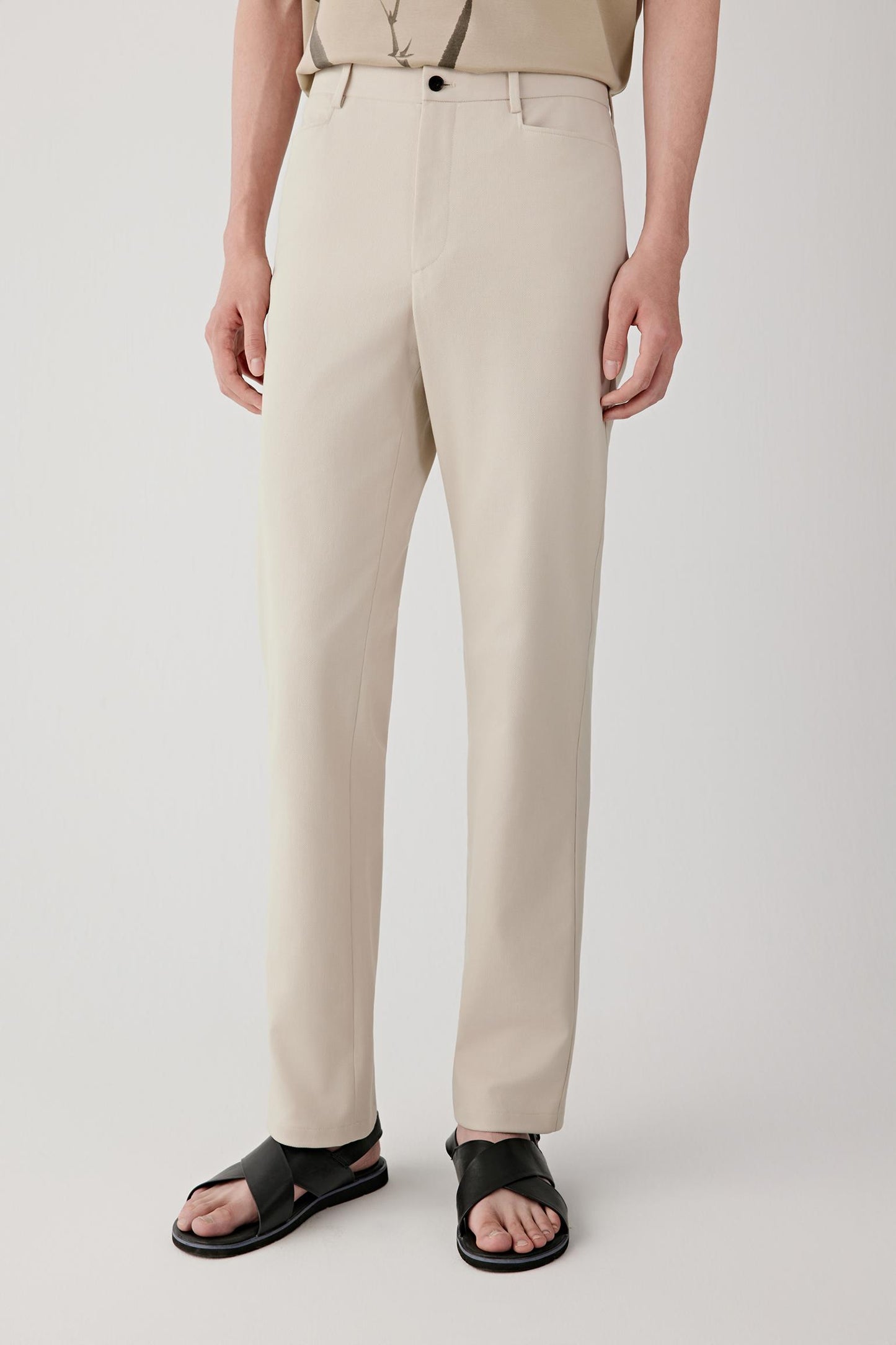 Front view of the trousers highlighting the straight-leg cut and clean waistband.