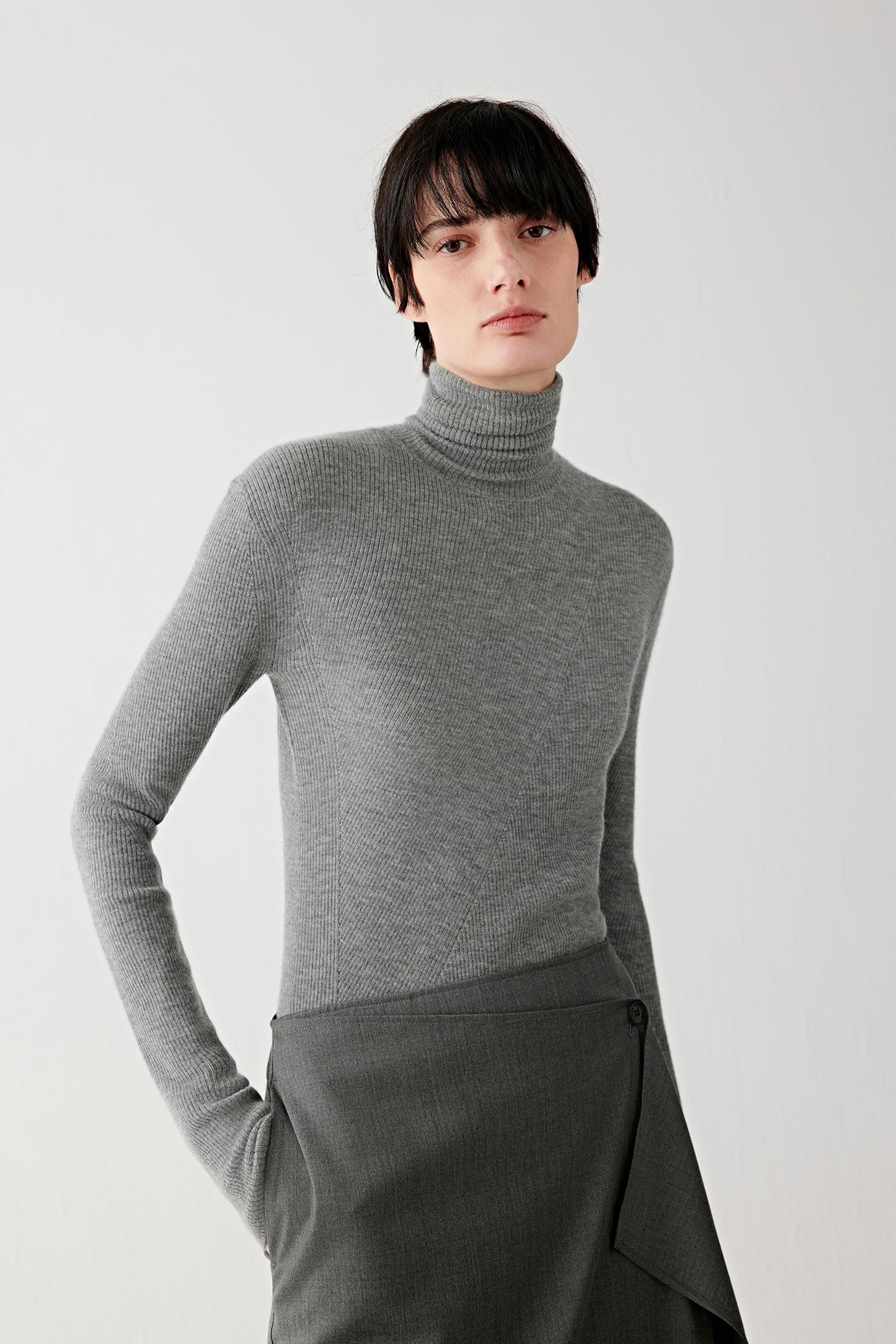Three-quarter front view highlighting the fine knit texture and close-to-body fit.