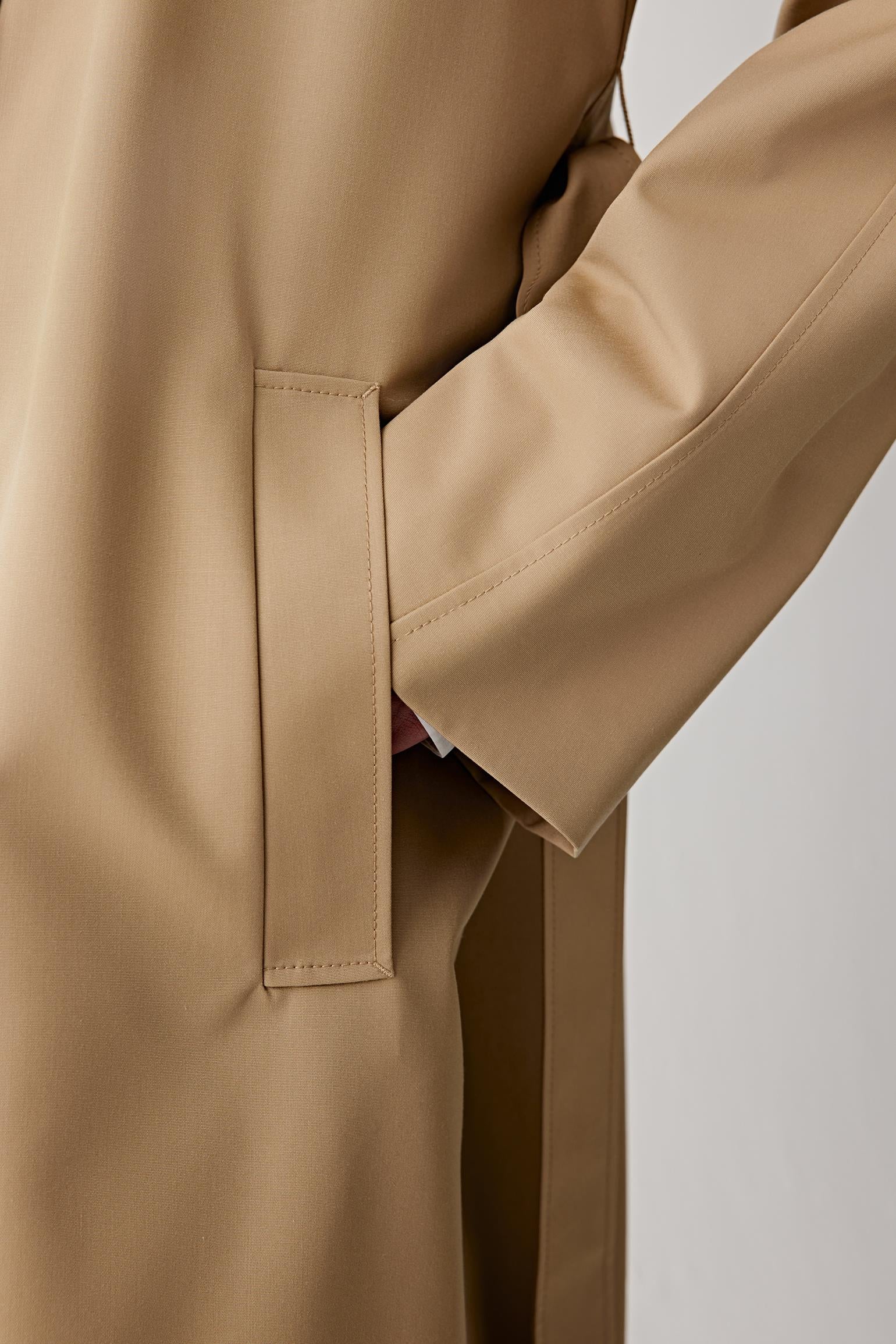 Close-up of the sleeve and cuff, showing refined finishing and subtle seam details.