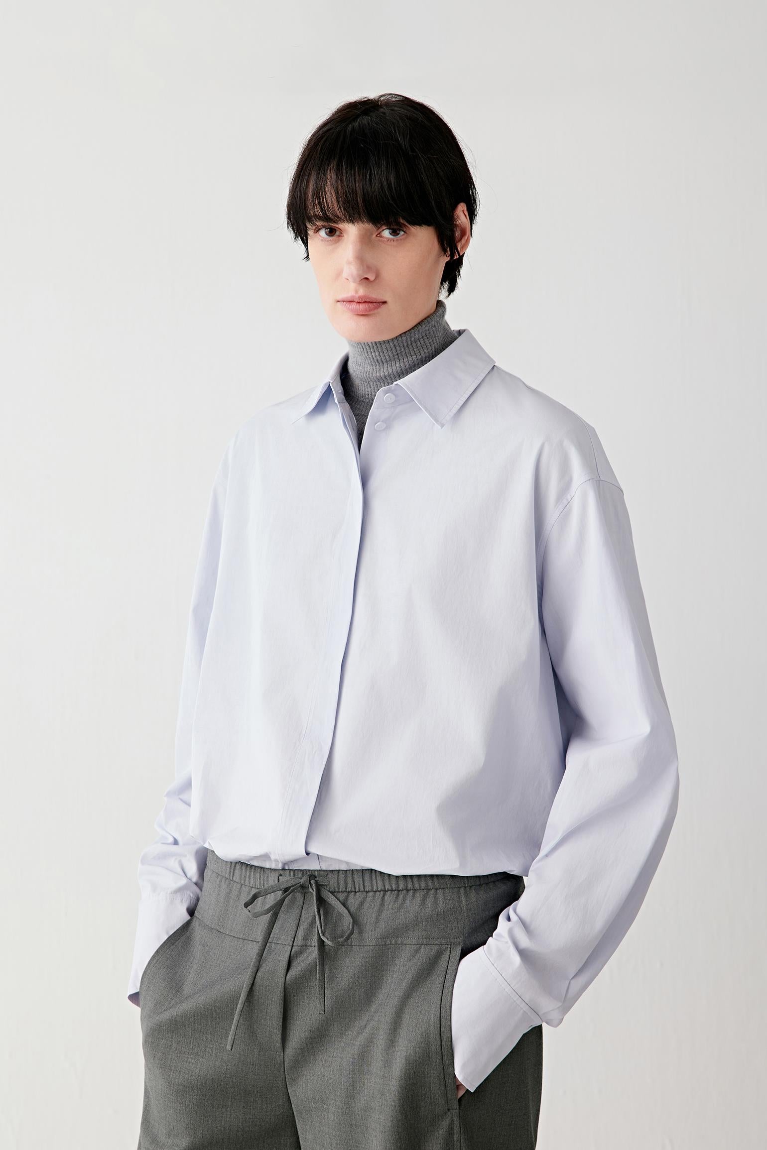 Three-quarter front view emphasizing the fluid drape and relaxed silhouette.