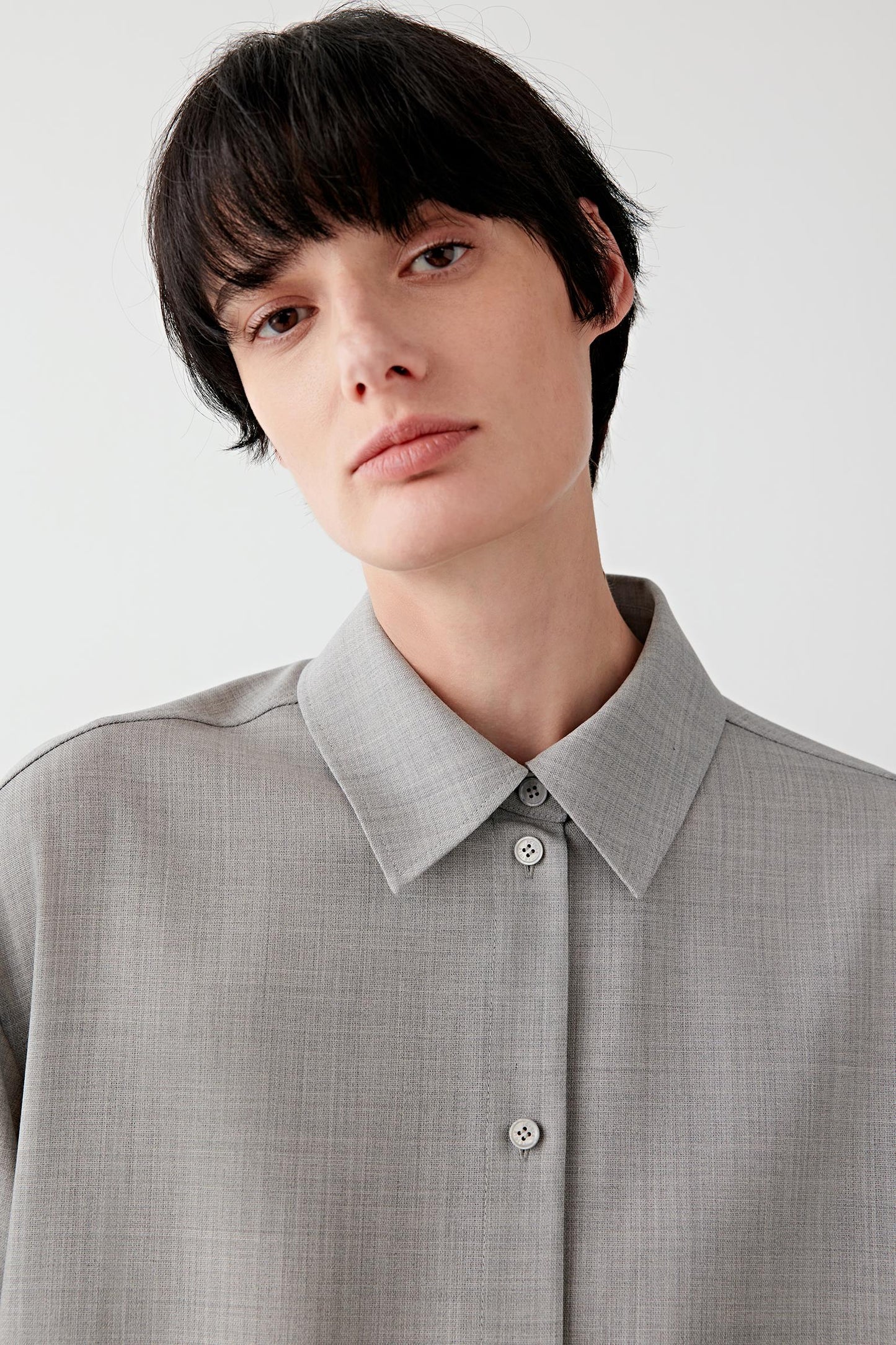 Close-up of the collar and concealed button placket in twist wool.