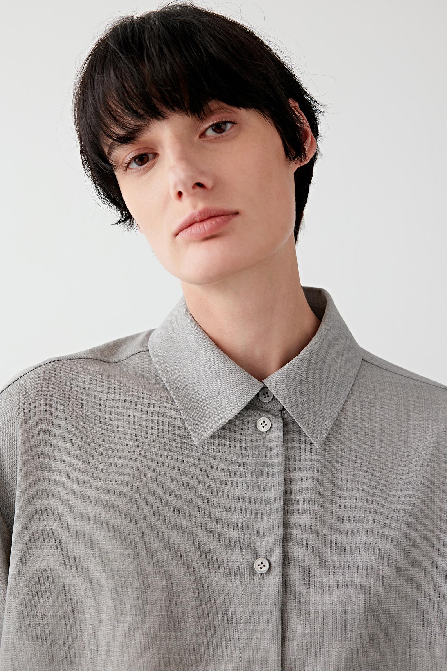 Close-up of the collar and concealed button placket in twist wool.