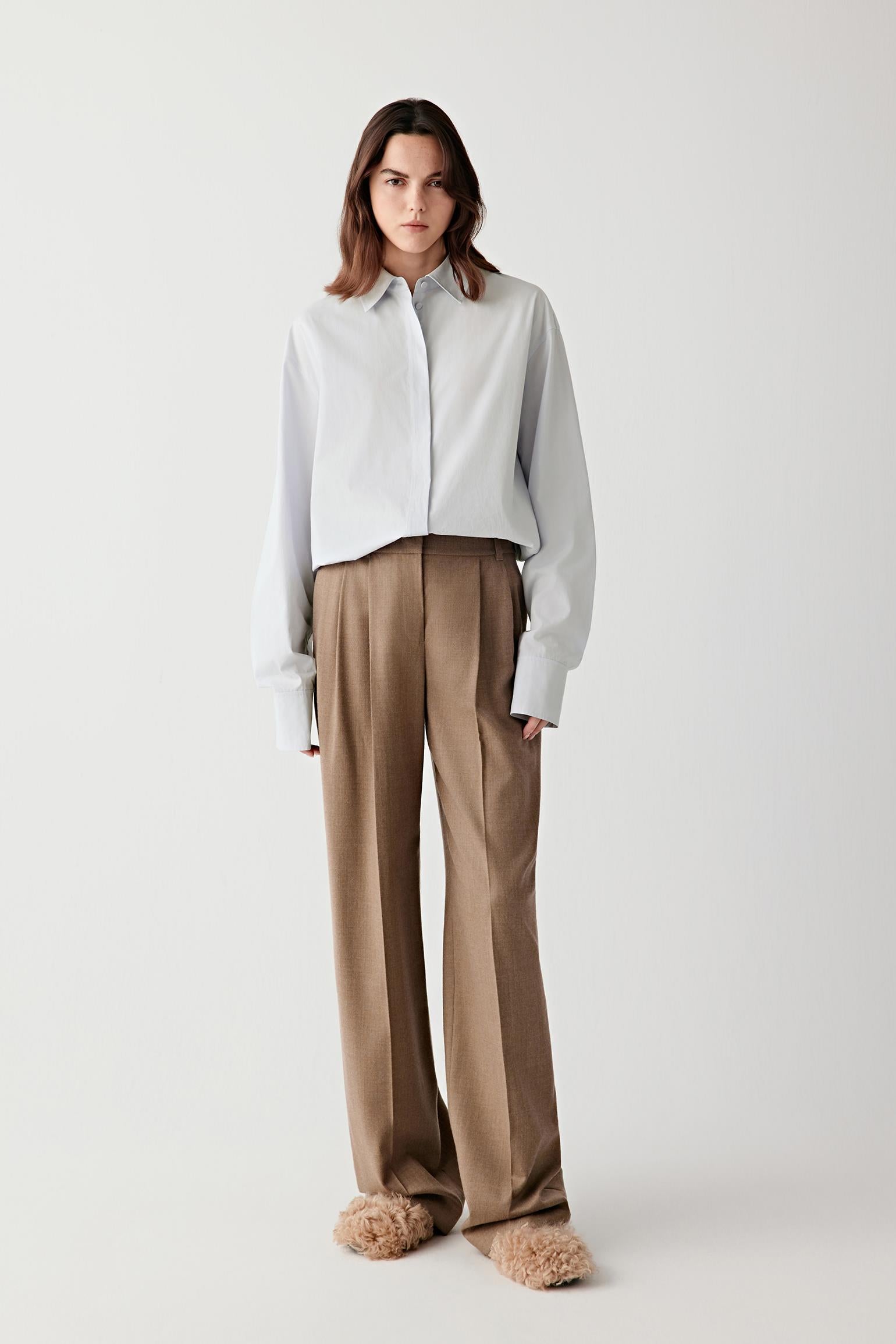 Full-length front view of straight-leg trousers in soft light brown wool flannel.