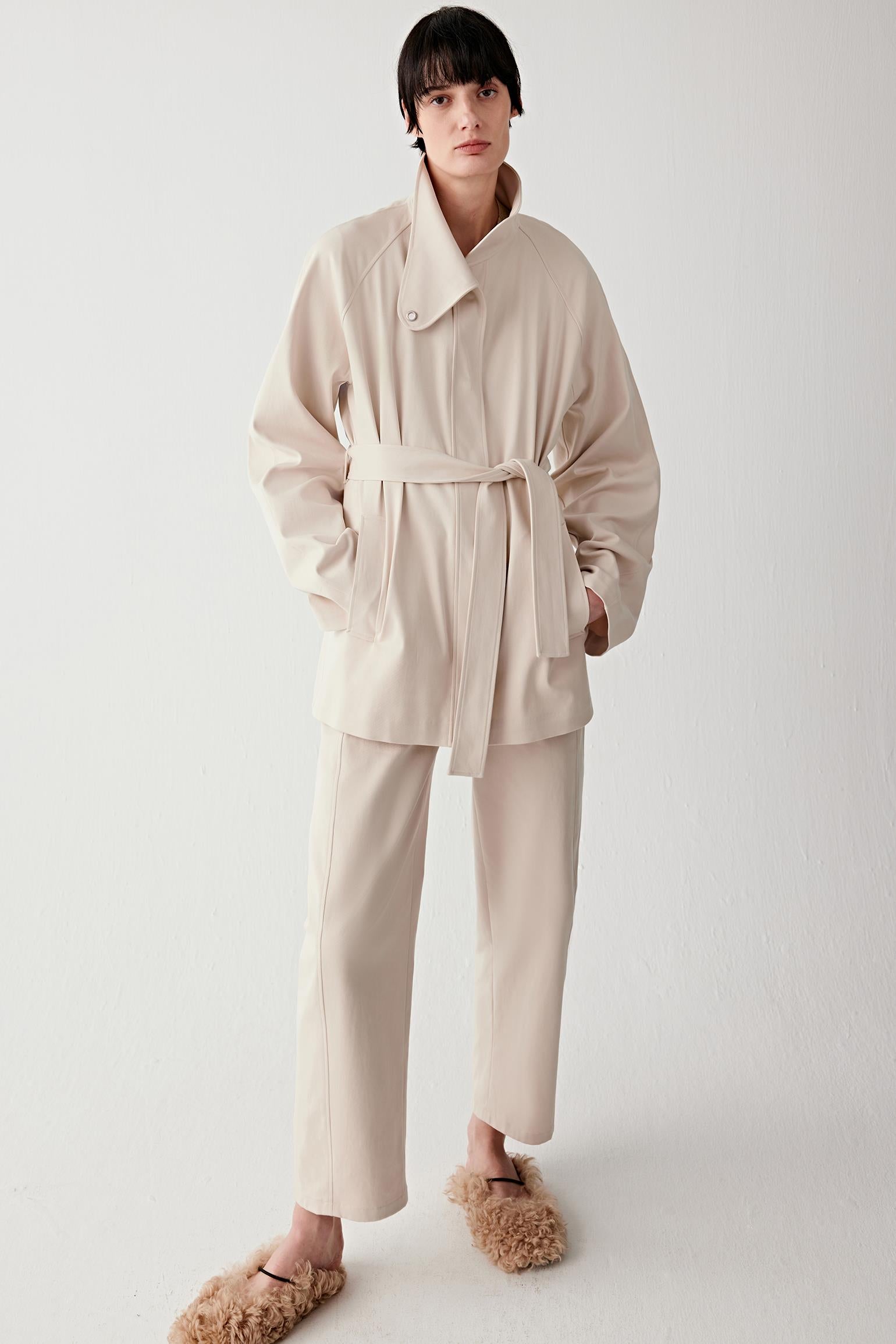 Full-length front view highlighting length, belted waist and balanced proportions