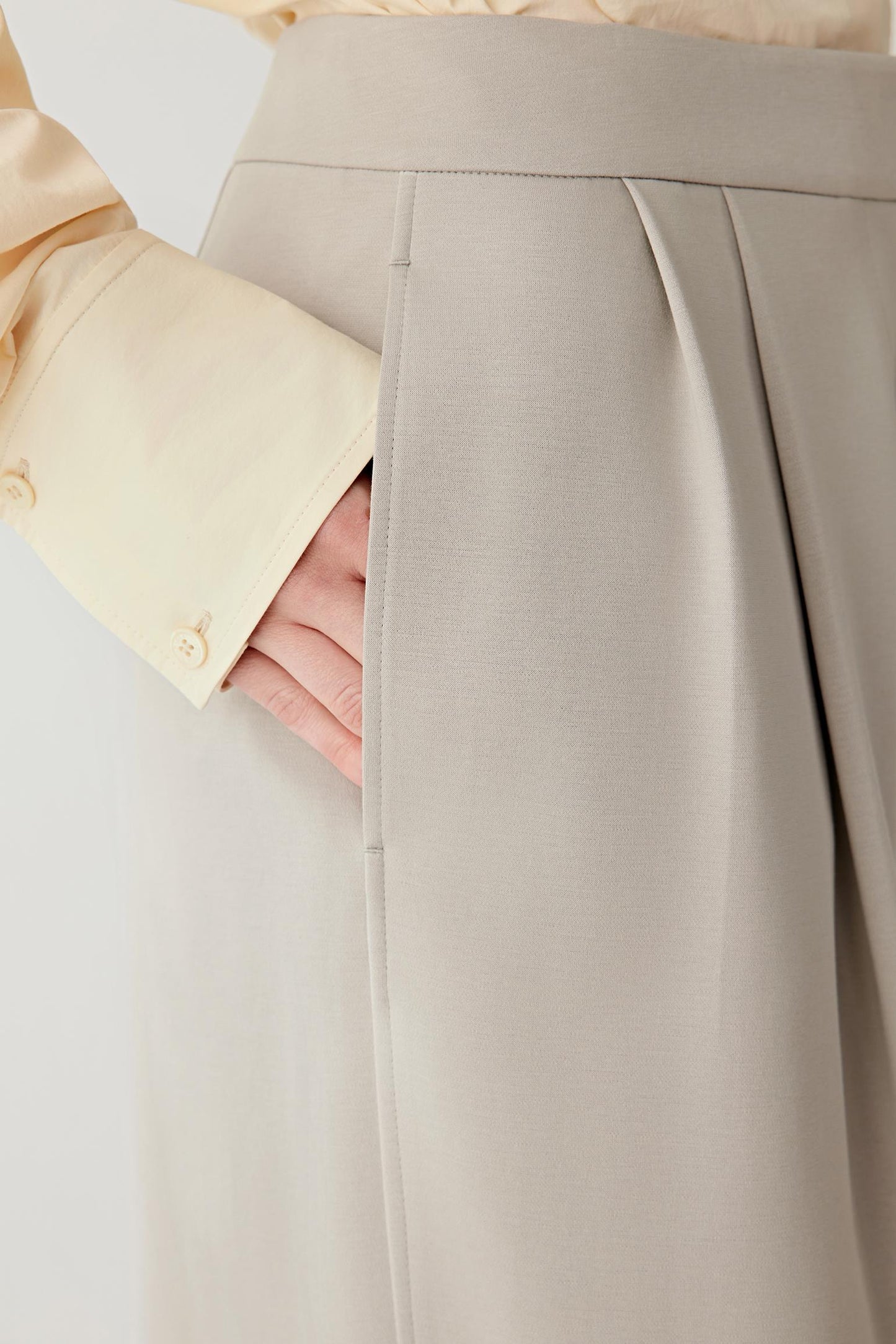 Close-up of the fabric texture, revealing the soft, matte surface of the cotton stretch jersey.