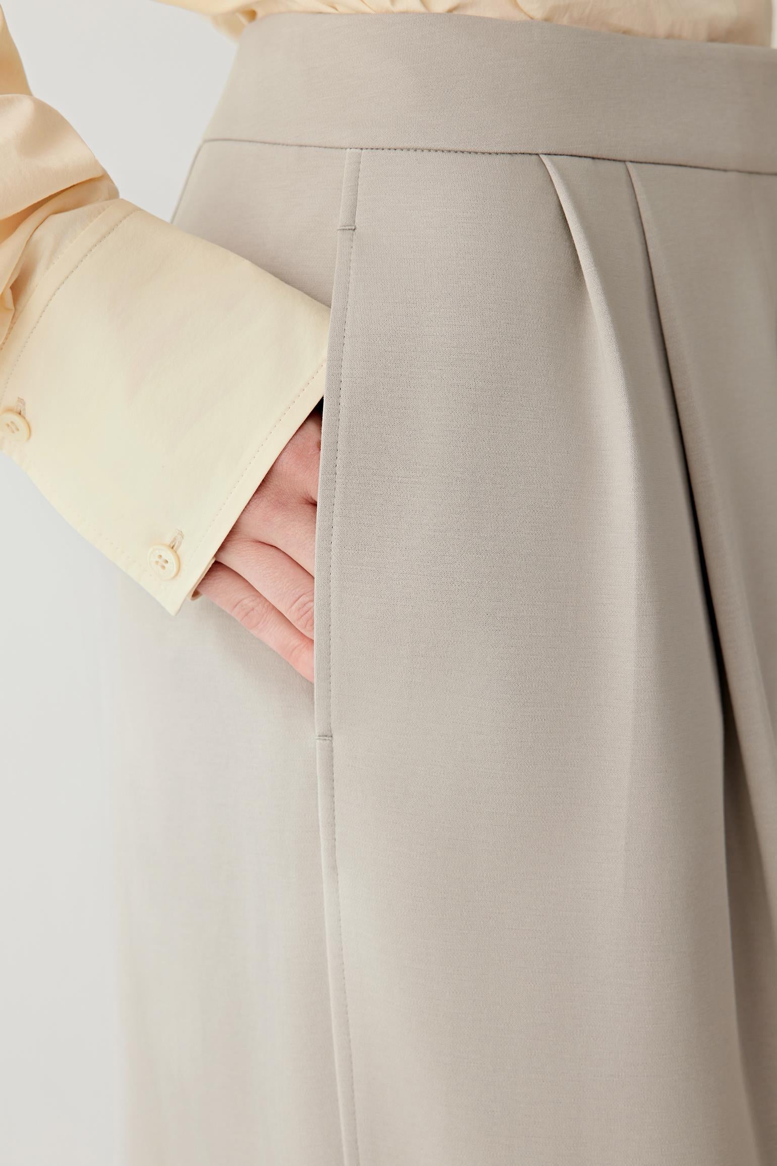 Close-up of the fabric texture, revealing the soft, matte surface of the cotton stretch jersey.