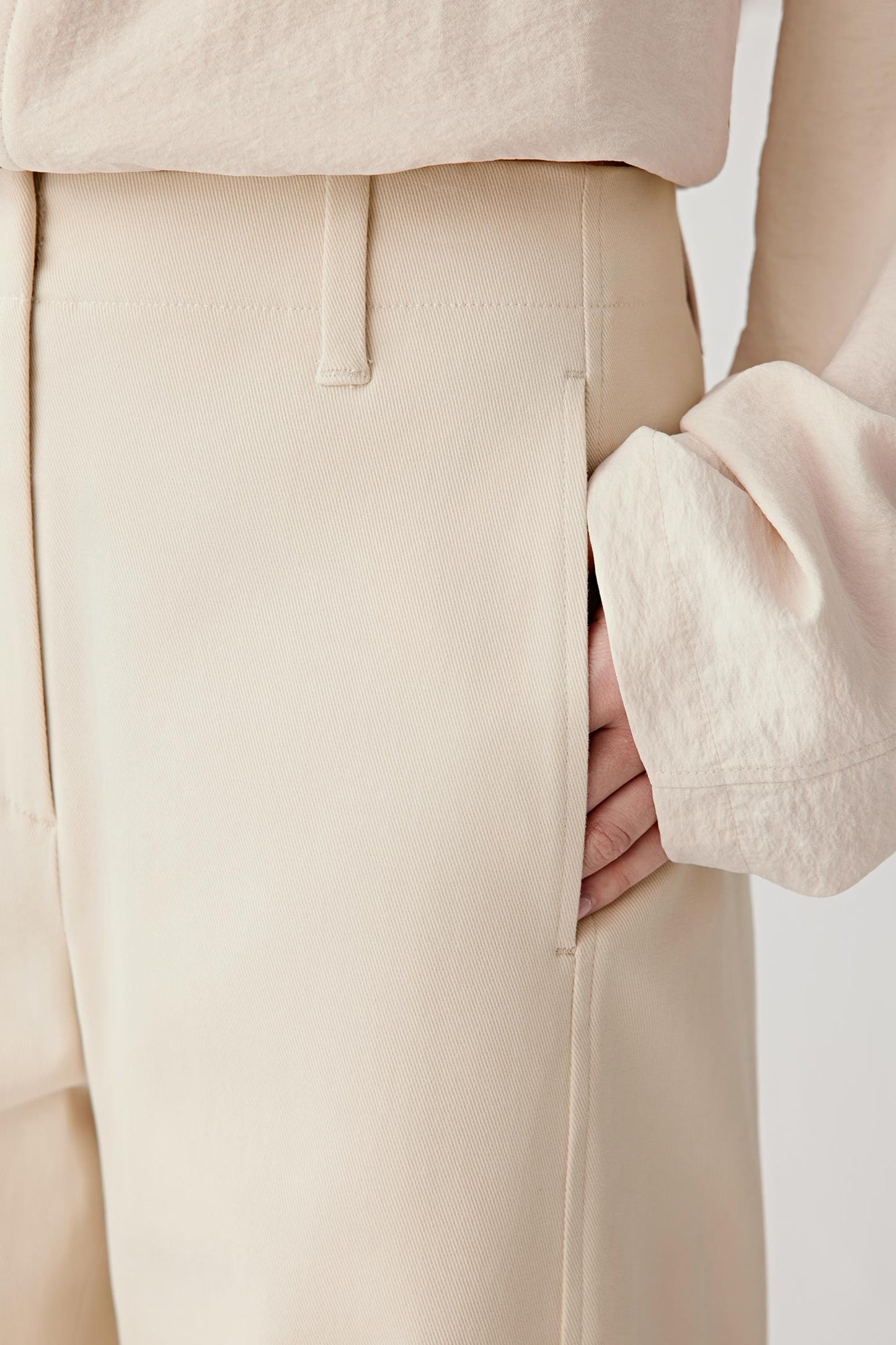 Close-up of side seam and pocket showing tailoring details and refined finish