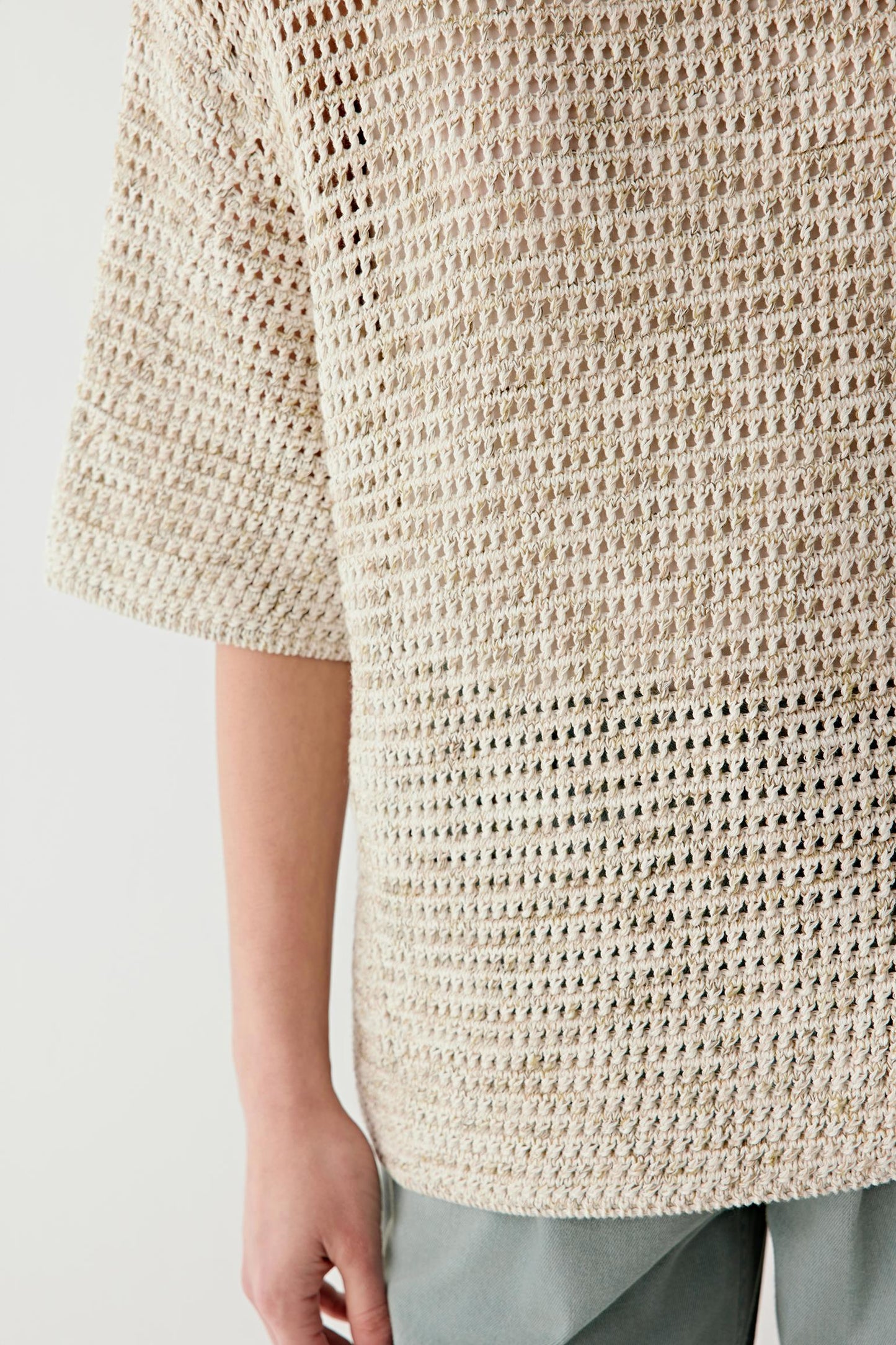 Close-up of knit showing open weave structure, texture and transparency