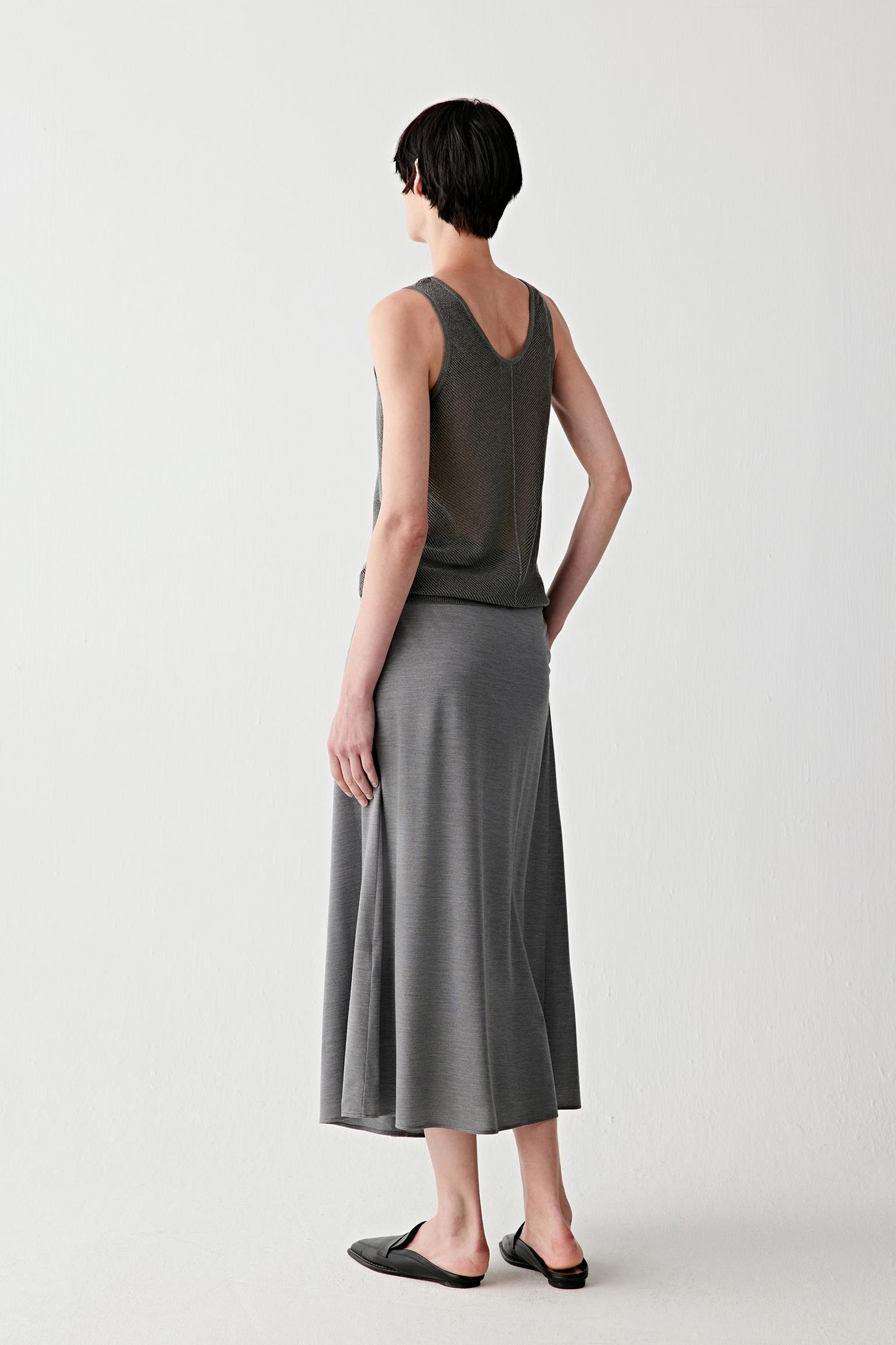 Side or back view highlighting the vertical knit panel at the back and the softly structured silhouette