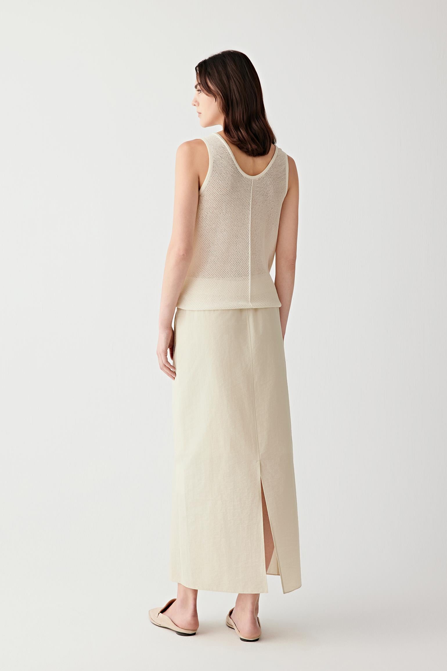 Side or back view highlighting the vertical knit panel at the back and the soft movement of the lightweight knit fabric