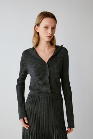 Front view highlighting the deep V-neckline, button-front fastening and fitted shape of the dark grey melange cardigan.