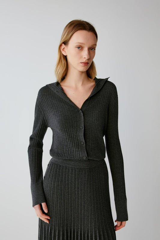 Front view highlighting the deep V-neckline, button-front fastening and fitted shape of the dark grey melange cardigan.