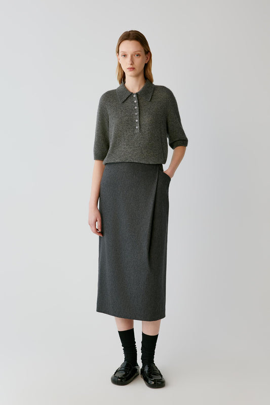Front full-length view of a woman wearing the smoke grey cashmere and silk top, highlighting the straight silhouette and elbow-length sleeves.