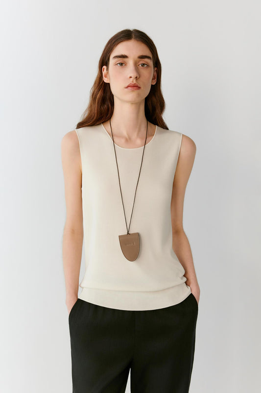Front view showing the relaxed fit and natural drape of the fine-gauge silk knit. The image emphasizes the lightweight construction, clean lines and the way the fabric follows the body's movement.