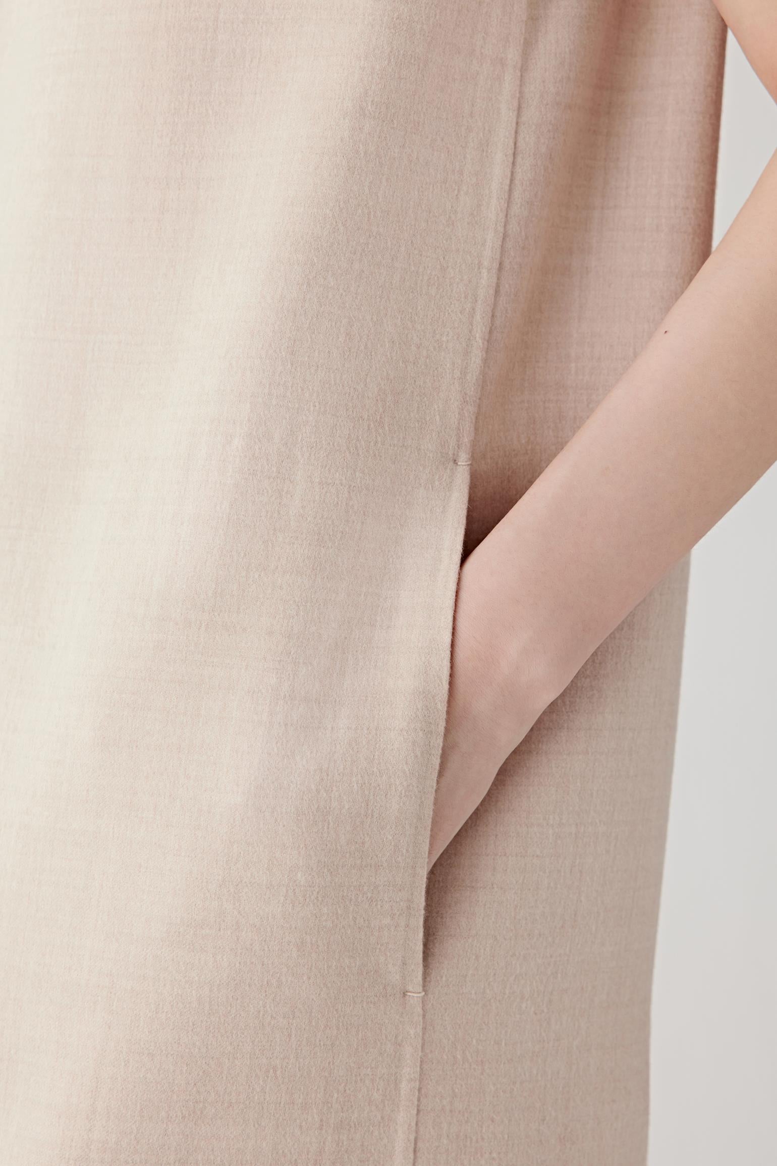 Close-up detail of the side seam and fabric surface highlighting the soft texture and subtle melange weave of the wool.