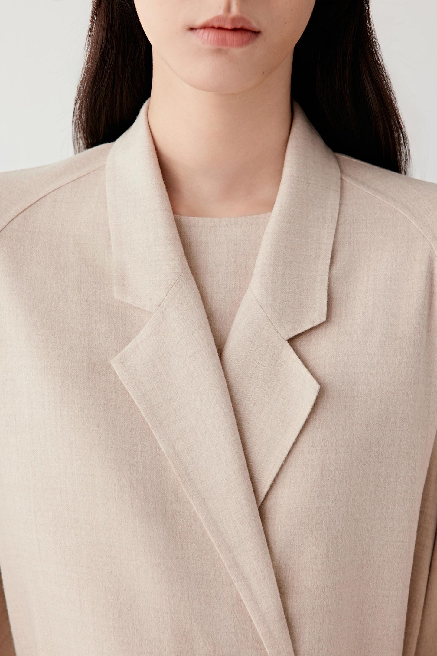 Close-up of the lapel and structured collar detail.