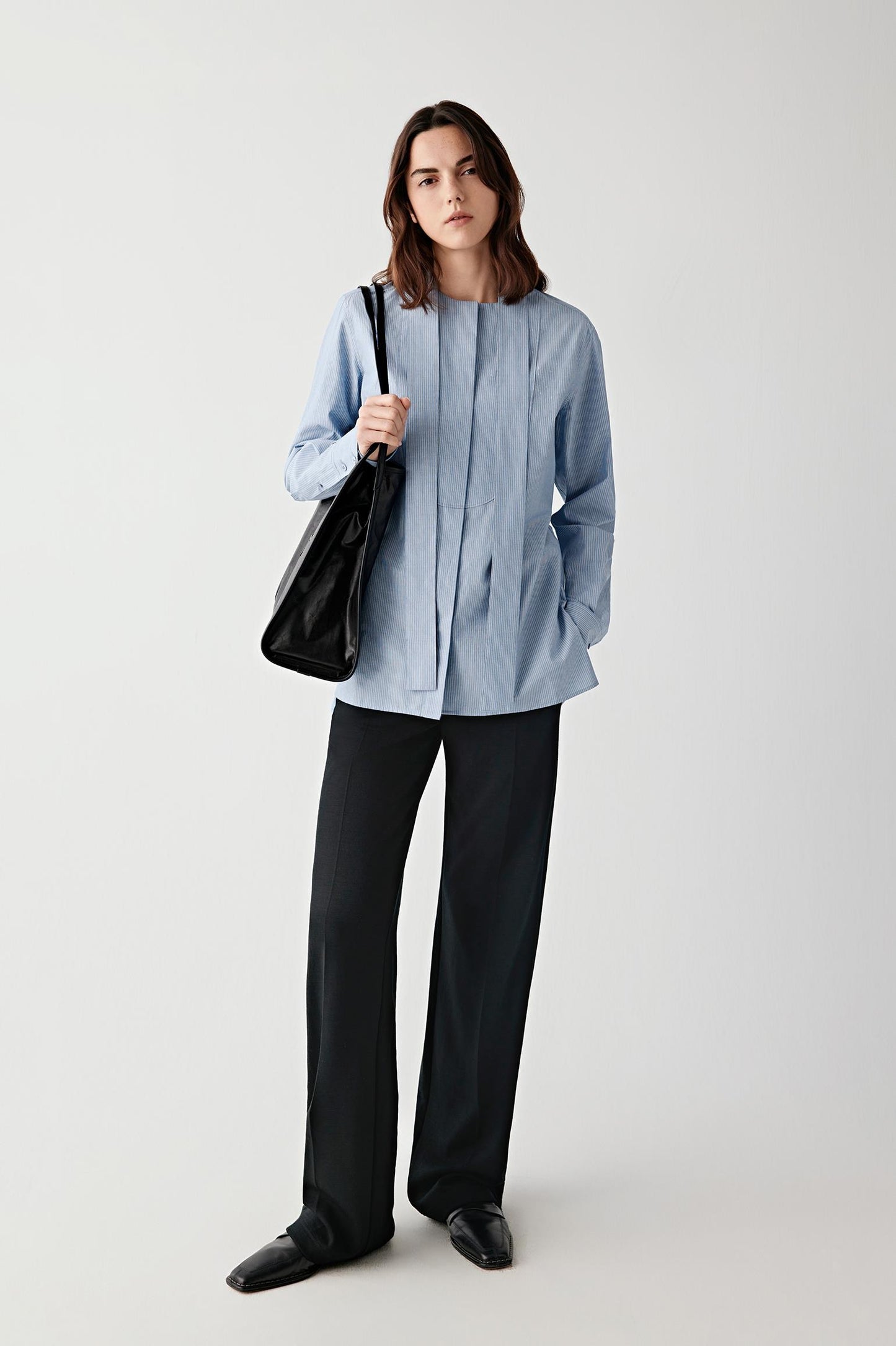 Full-length view highlighting size, clean lines and how the bag integrates into the outfit