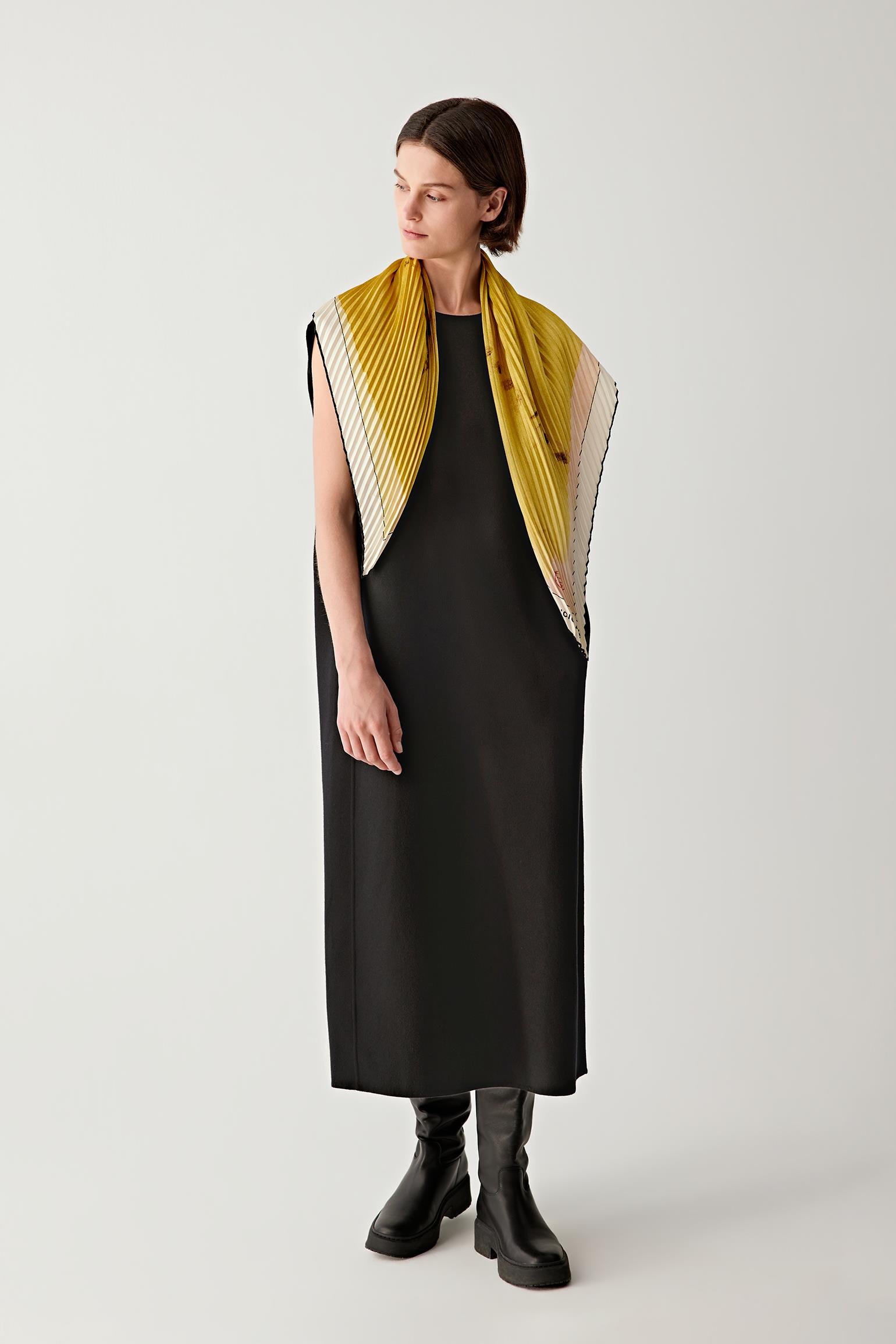 Three-quarter view showing the scarf wrapped around the neck.