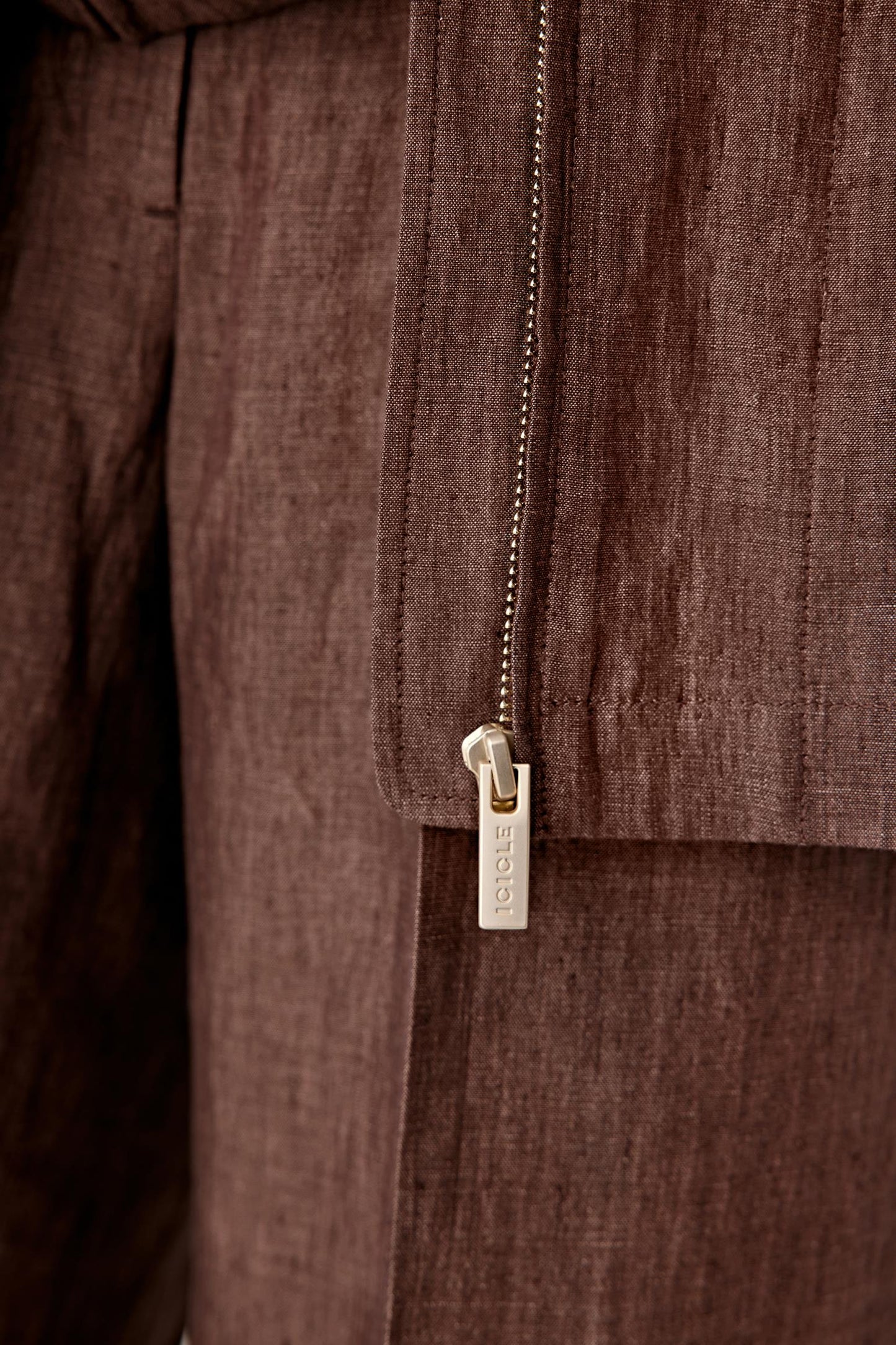 Close-up of the fabric surface showing the natural slub texture, matte appearance and subtle irregularities in the yarn-dyed weave