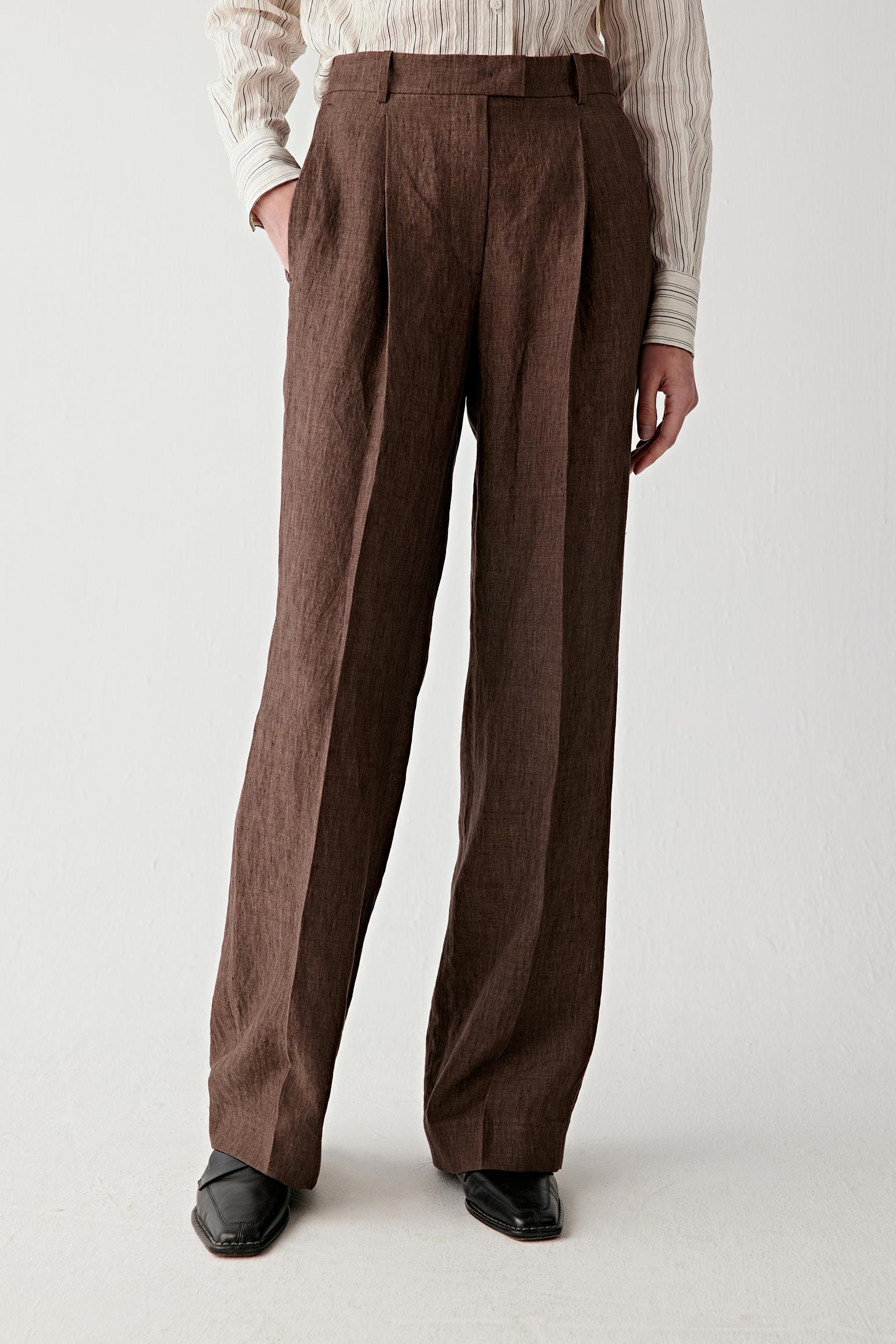 Mid-length front view focusing on the waist and upper leg, showing waistband placement, smooth front and the beginning of the straight leg line