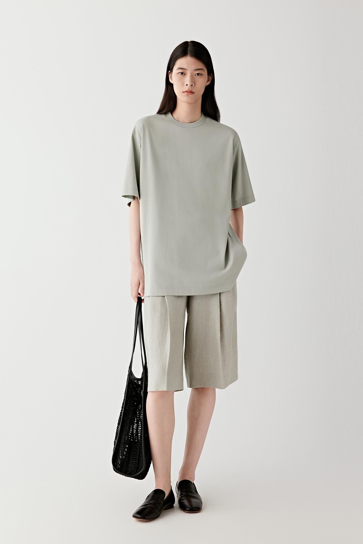 Full-length view showing proportion, drop length and how the bag sits against the body during wear