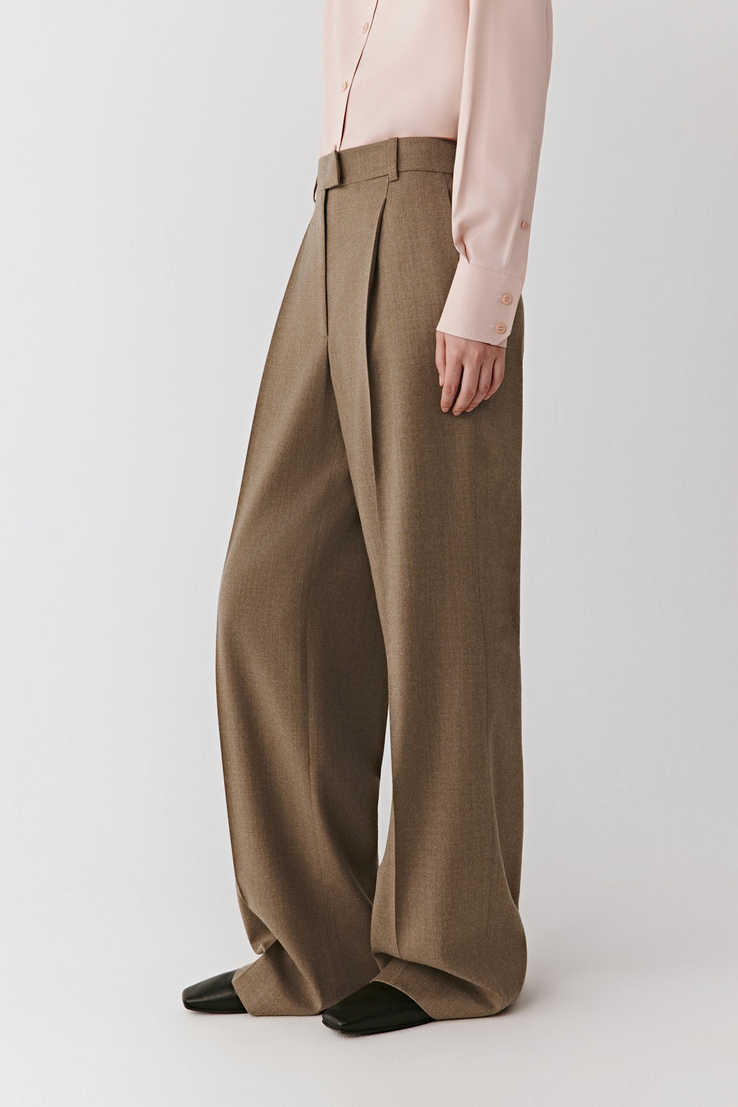 Side view highlighting the soft drape and natural sheen of the brushed wool fabric.