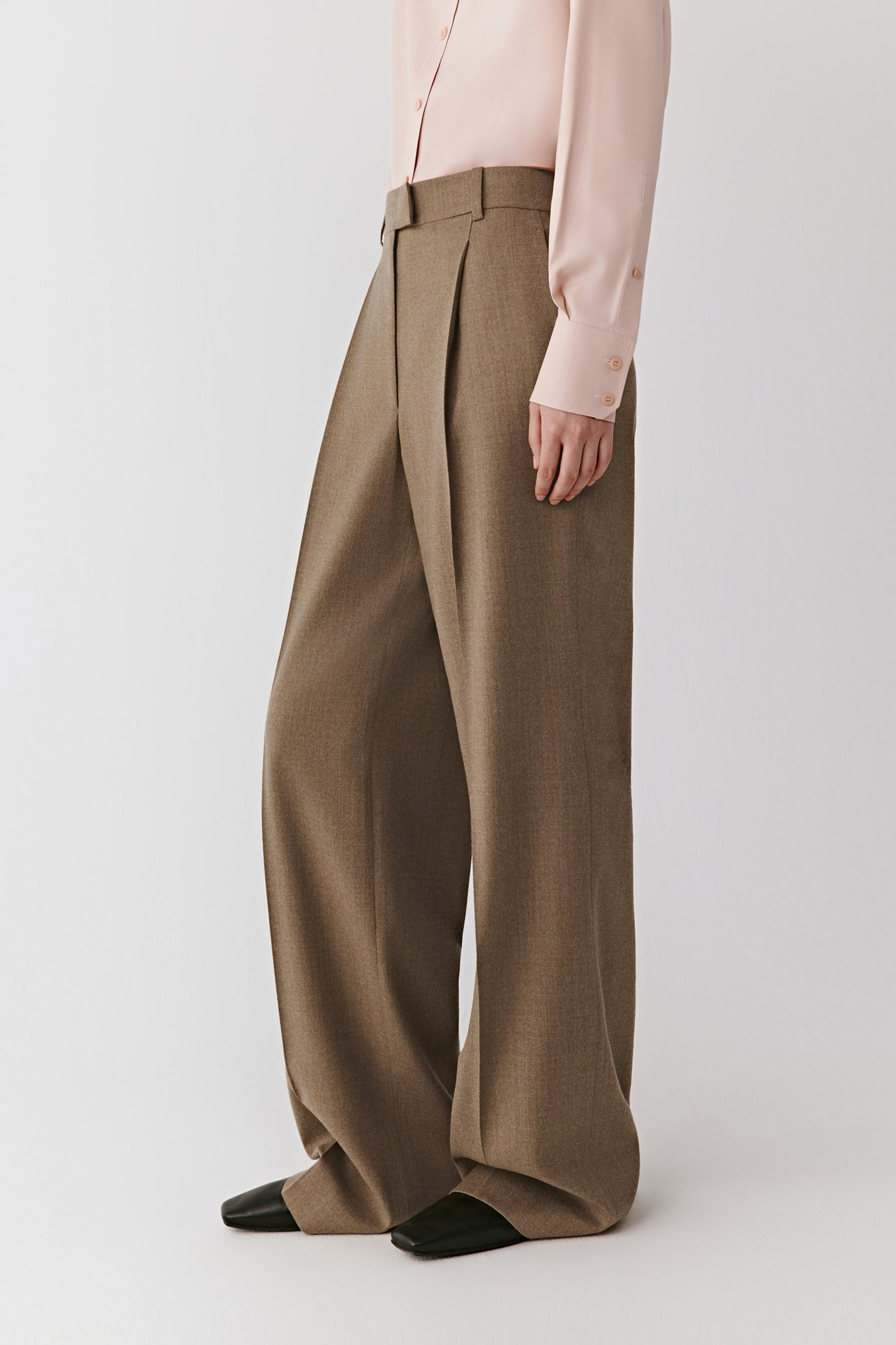 Side view highlighting the soft drape and natural sheen of the brushed wool fabric.