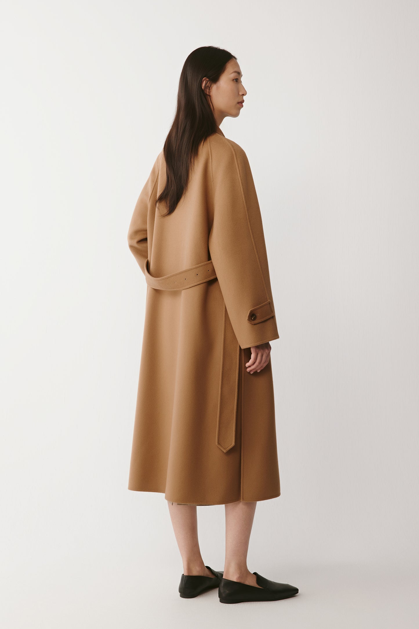 Back view showing the elegant fall and soft movement of the material.