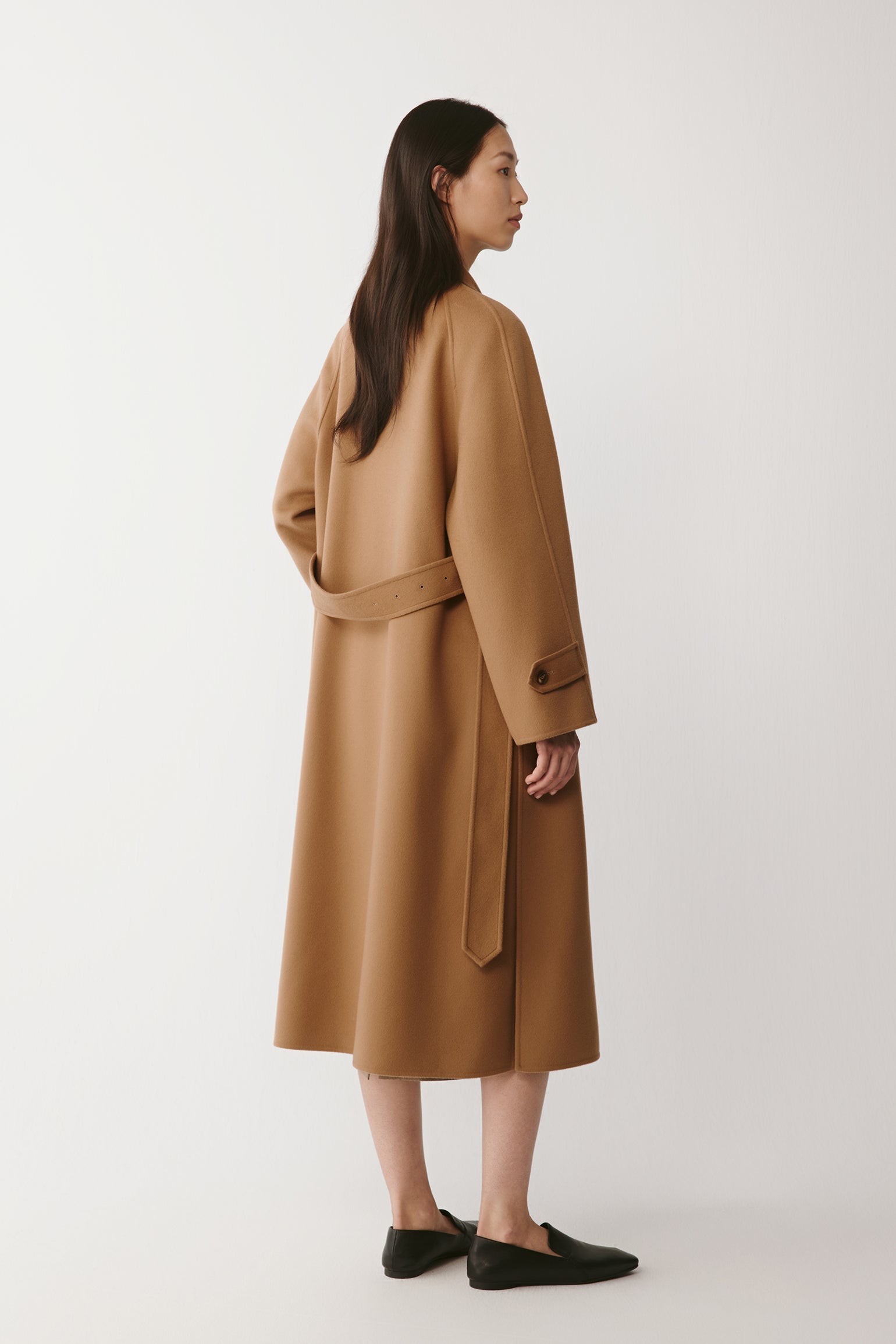 Back view showing the elegant fall and soft movement of the material.