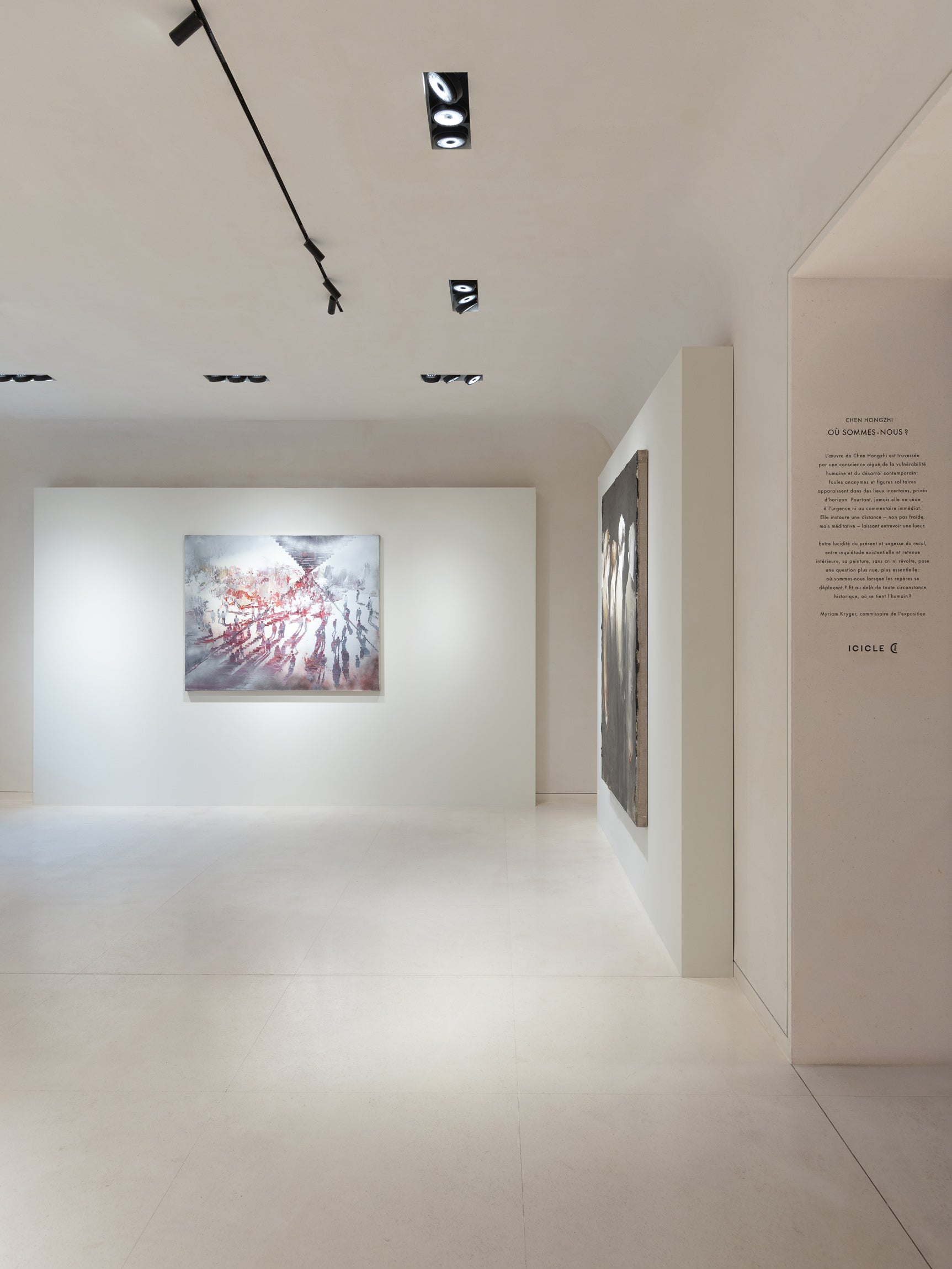 Abstract paintings on a white wall in a gallery setting