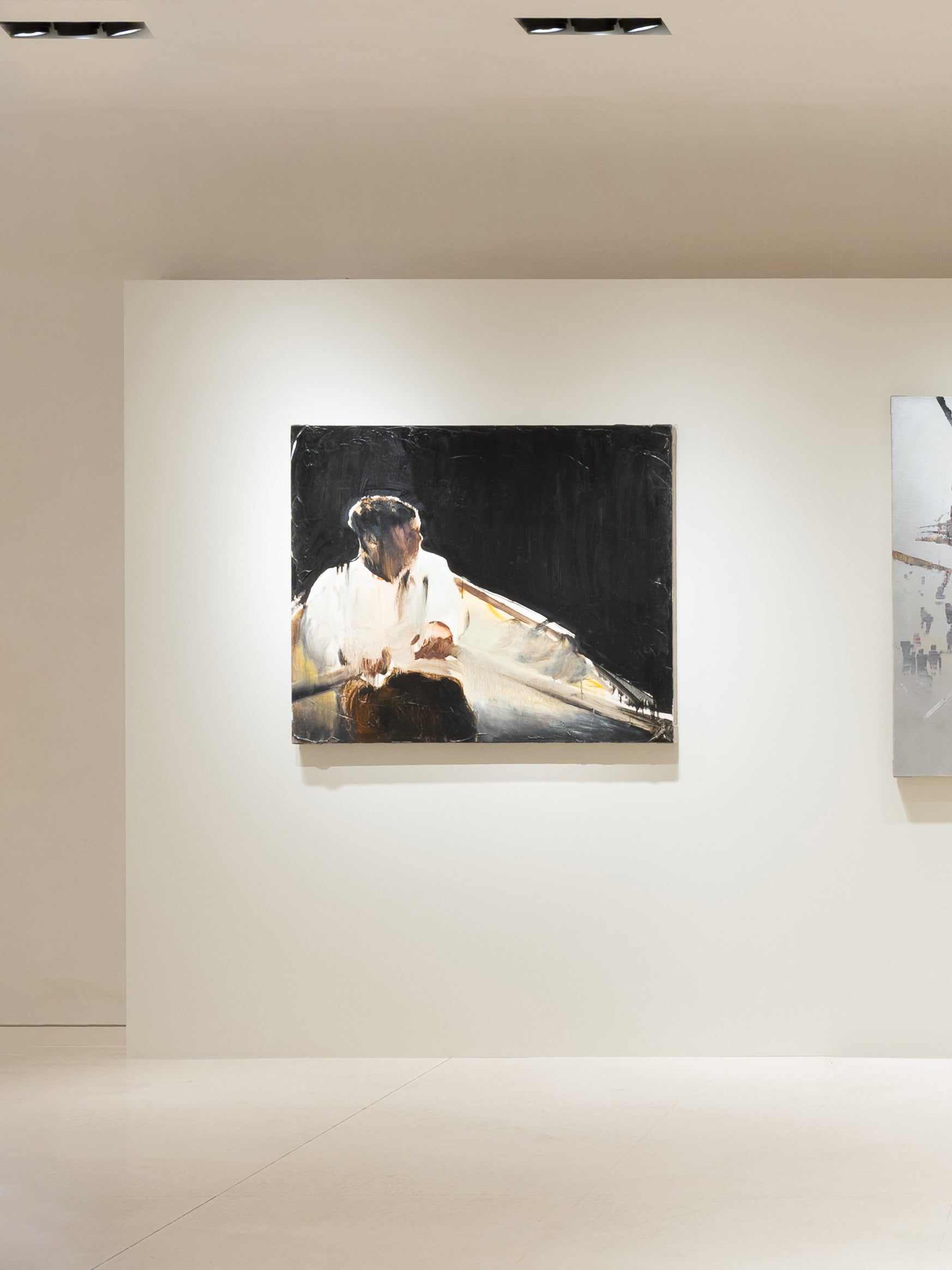 Abstract paintings on a white wall in a gallery setting