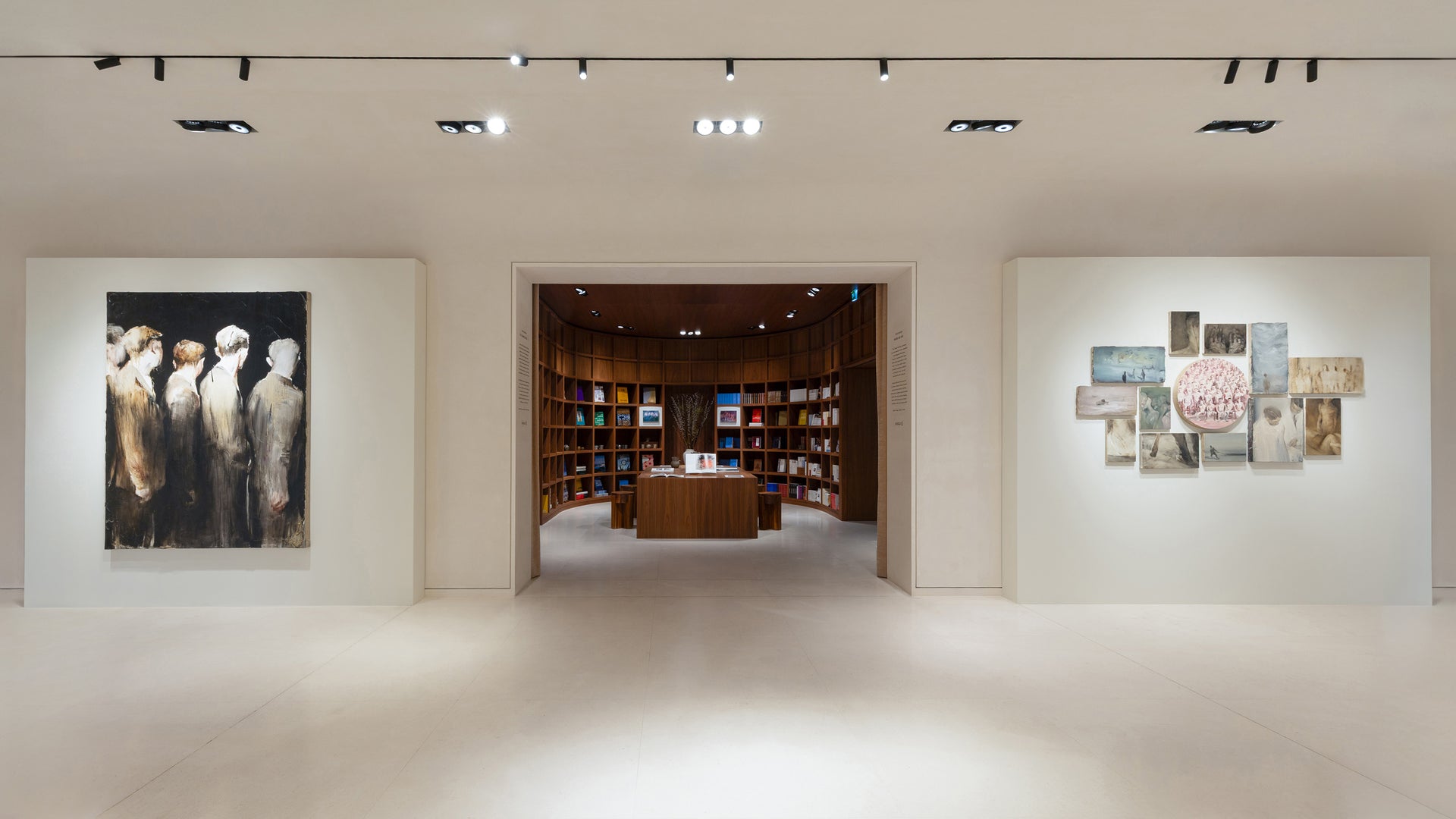 Abstract paintings on a white wall in a gallery setting