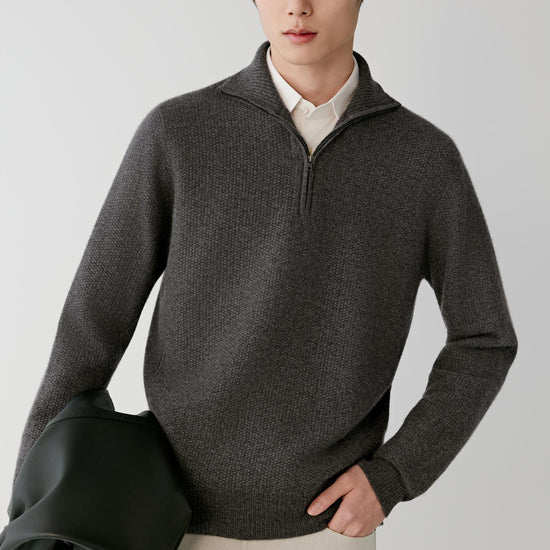 Video Front view of a man wearing a smoke grey cashmere pullover, showing the half-zip high collar, long sleeves and straight silhouette.