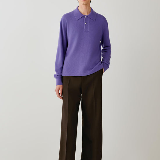Video of a man wearing a purple cashmere polo pullover, showing the relaxed silhouette and movement of the fine-gauge knit as he moves.