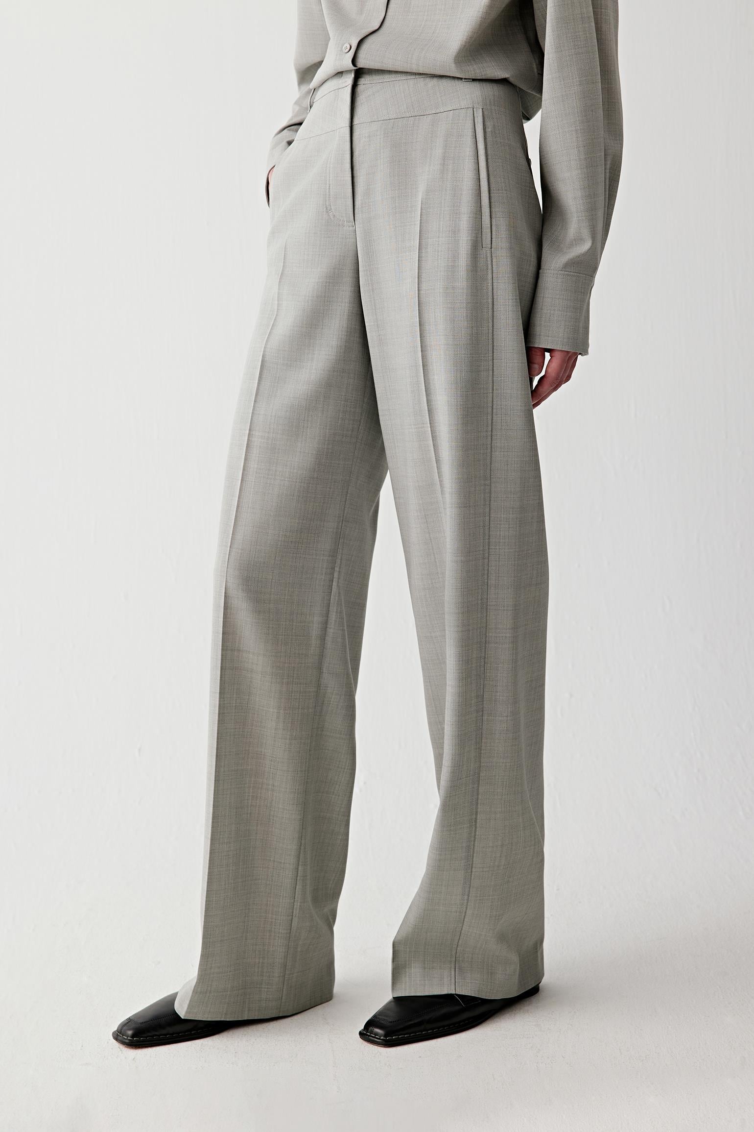 Video of the trousers in motion, emphasizing the fluid drape and straight-leg silhouette.