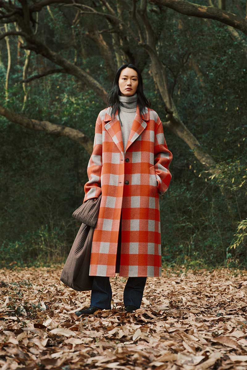 woman standing in forest