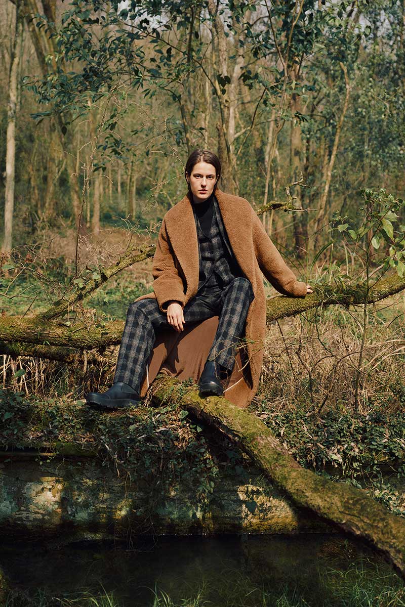 woman sitting in forest