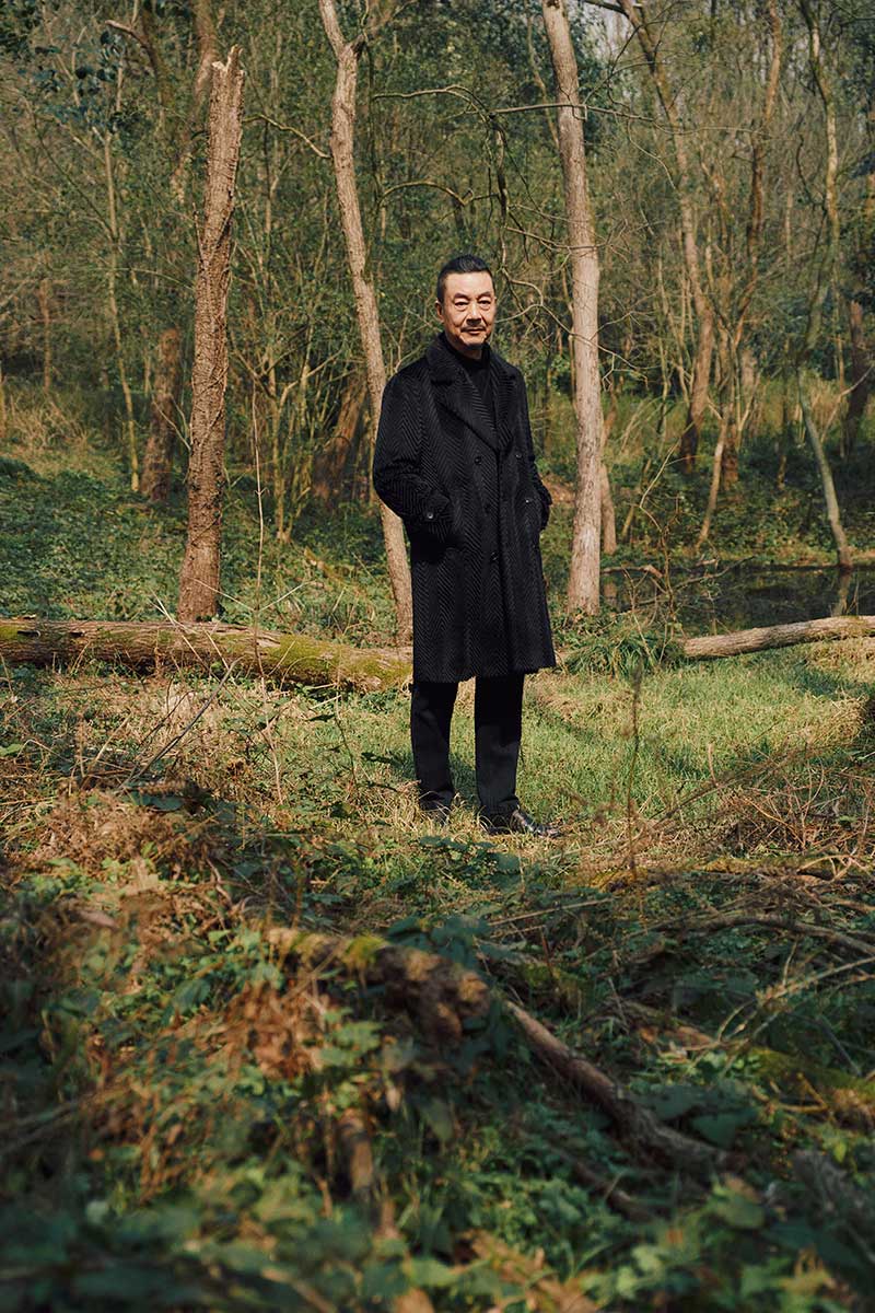 man standing in forest