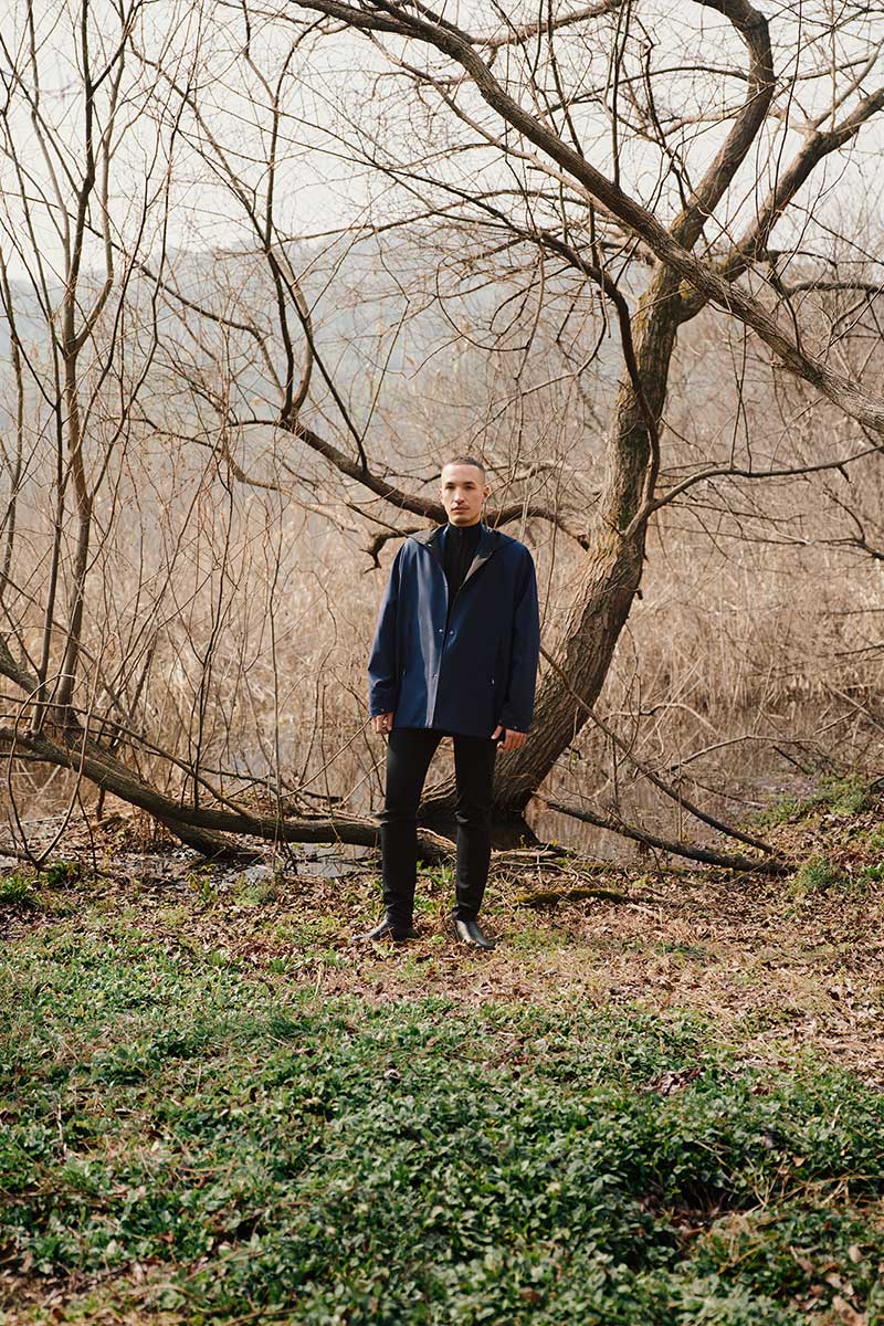 man standing in forest