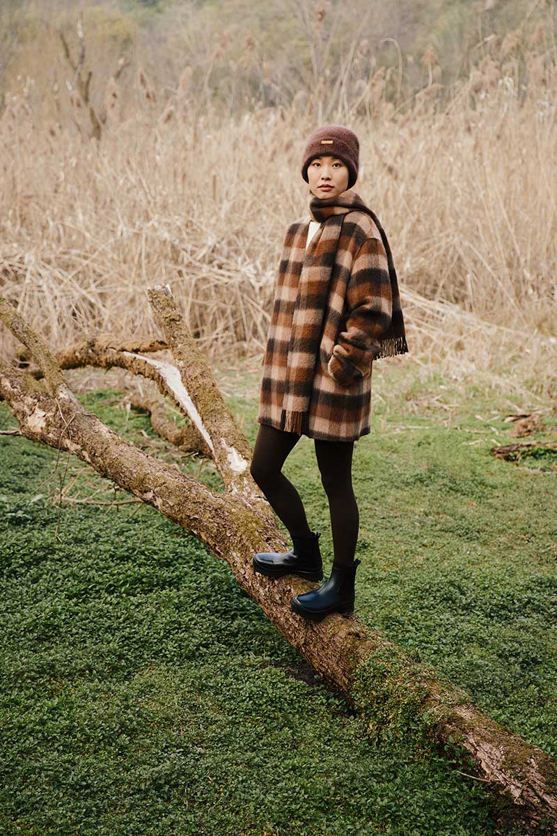 woman standing in forest